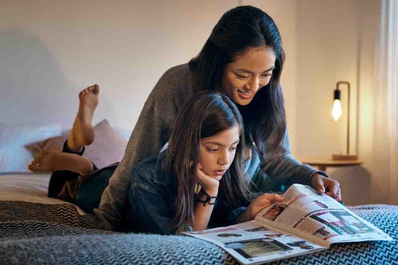 Mother and daughter reading together